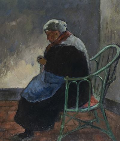 Donna Seduta che Lavora